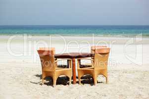 The table and chairs on beach of the luxury hotel, Ajman, UAE