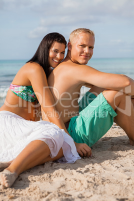 Happy young couple sunbathing