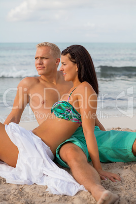 Happy young couple sunbathing