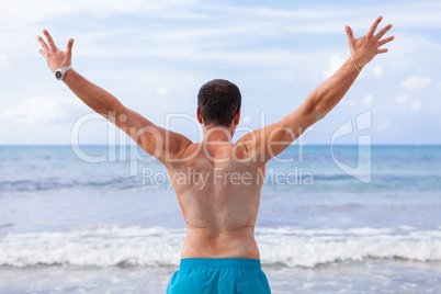 attractive young athletic man on the beach