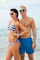 Sexy trendy couple posing in swimwear at the sea