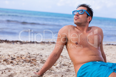 attractive young athletic man on the beach