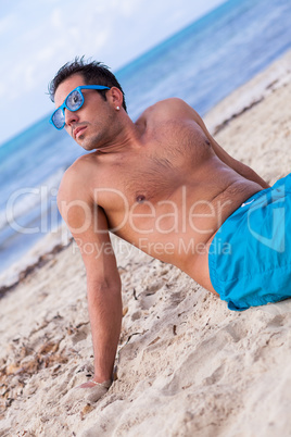 attractive young athletic man on the beach