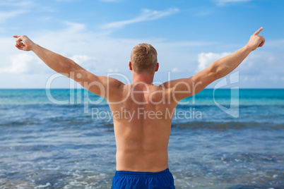 attractive young athletic man on the beach