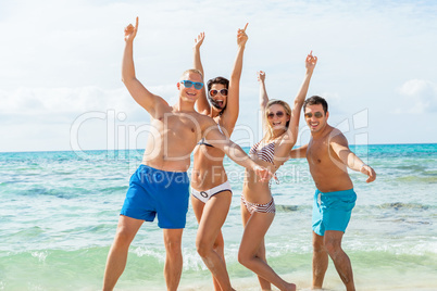 young happy friends havin fun on the beach young happy friends havin fun on the beach