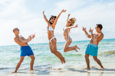 young happy friends havin fun on the beach young happy friends havin fun on the beach