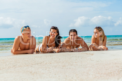 young happy friends havin fun on the beach