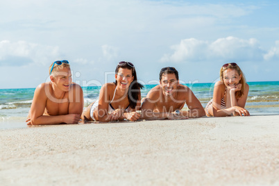 young happy friends havin fun on the beach