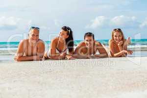 young happy friends havin fun on the beach