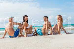 young happy friends havin fun on the beach