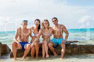 young happy friends havin fun on the beach