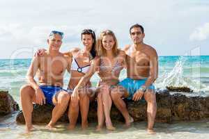 young happy friends havin fun on the beach