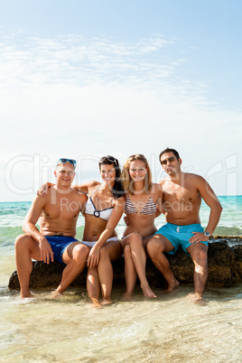 young happy friends havin fun on the beach