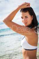 beautiful young brunette woman in bikini sea ocean