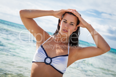 beautiful young brunette woman in bikini sea ocean