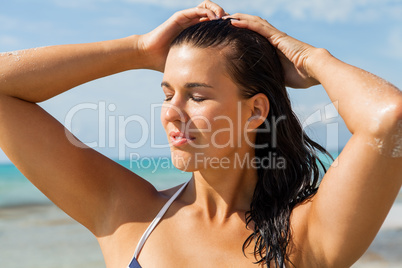 Young woman looking far away in the beach