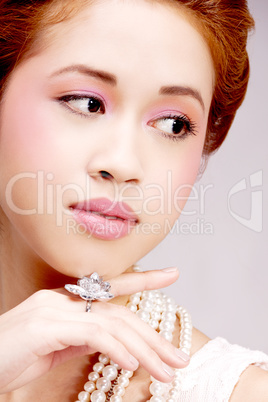 pretty asian girl with luxury jewelery and soft makeup