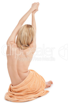 young blonde woman sitting on towel naked back isolated