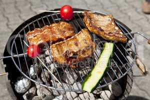 barbecue grill wiht meat outside in summer