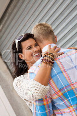 Romantic handsome man hugging his girlfriend