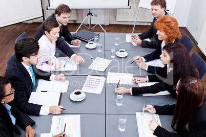 business team on table in office conference