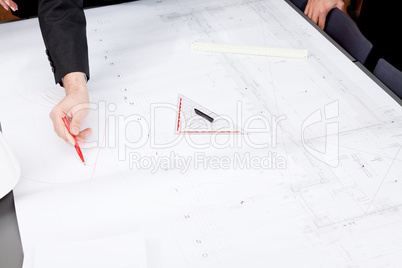 business people discussing architecture plan sketch