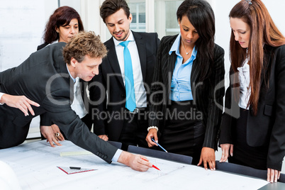 business people discussing architecture plan sketch