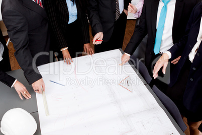 business people discussing architecture plan sketch