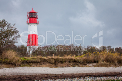 landscape baltic sea dunes lighthouse in red and white