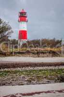 landscape baltic sea dunes lighthouse in red and white