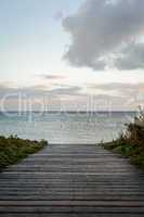 Bridge or pier across an expanse of sea