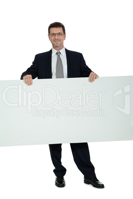 mature smiling businessman holding billboard copyspace isolated