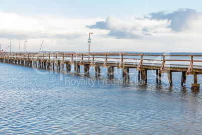 Bridge or pier across an expanse of sea