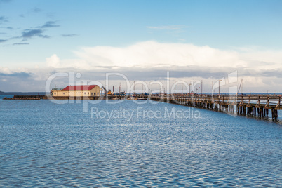 Bridge or pier across an expanse of sea