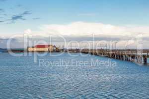 Bridge or pier across an expanse of sea