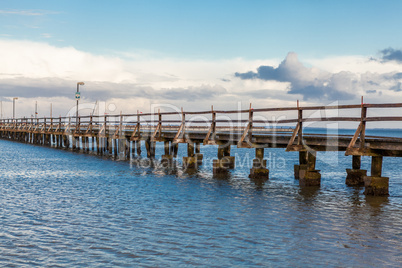 Bridge or pier across an expanse of sea