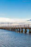 Bridge or pier across an expanse of sea