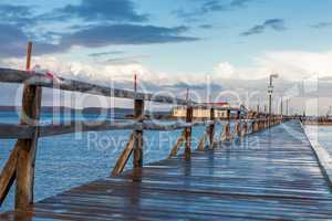 Bridge or pier across an expanse of sea