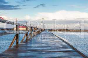 Bridge or pier across an expanse of sea