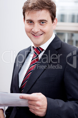 business man with tie and suit with documents