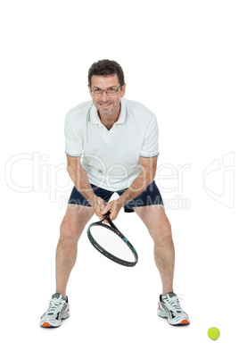 smiling adult tennis player with racket isolated