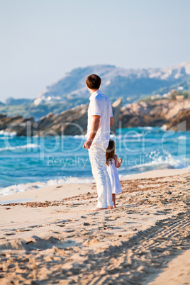 happy family father and daughter on beach having fun