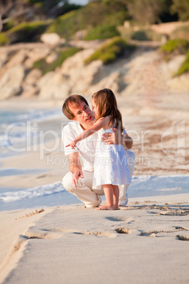 happy family father and daughter on beach having fun