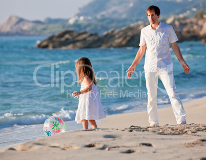 happy family father and daughter on beach having fun