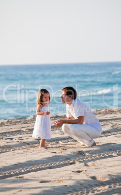 happy family father and daughter on beach having fun