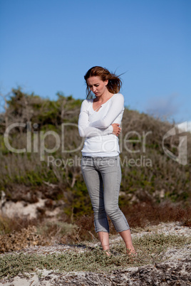 beautiful woman relax in summer outdoor in wind dune beach