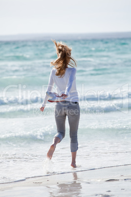 beautiful young woman relaxing at beach in summer