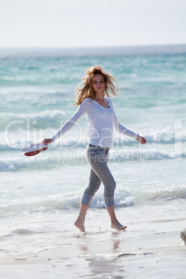 beautiful young woman relaxing at beach in summer