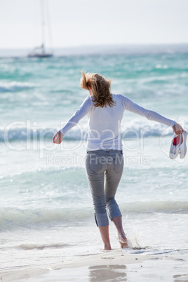 beautiful young woman relaxing at beach in summer