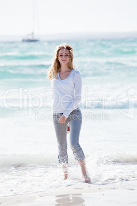 beautiful young woman relaxing at beach in summer